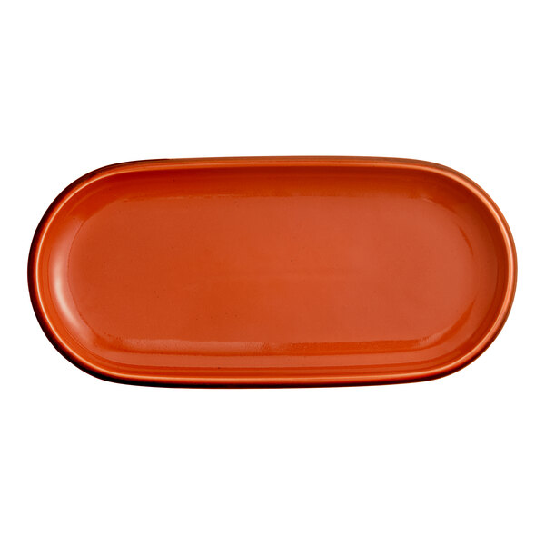 An orange stoneware oblong coupe platter.