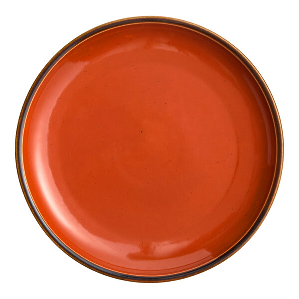 A round, orange porcelain coupe plate.
