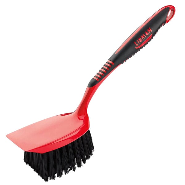 A red and black Libman short handle utility brush.