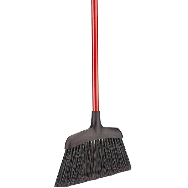 A close-up of a red and black Libman commercial angle broom with a handle.