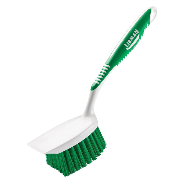 A white Libman utility brush with a green handle.