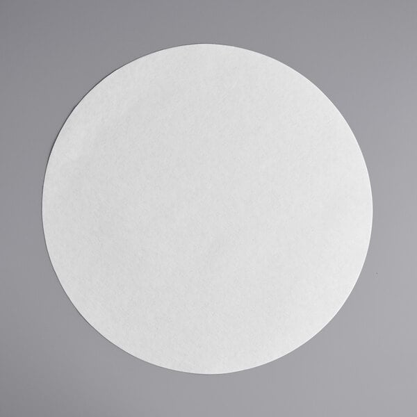 A white circle on a gray surface with a white background.
