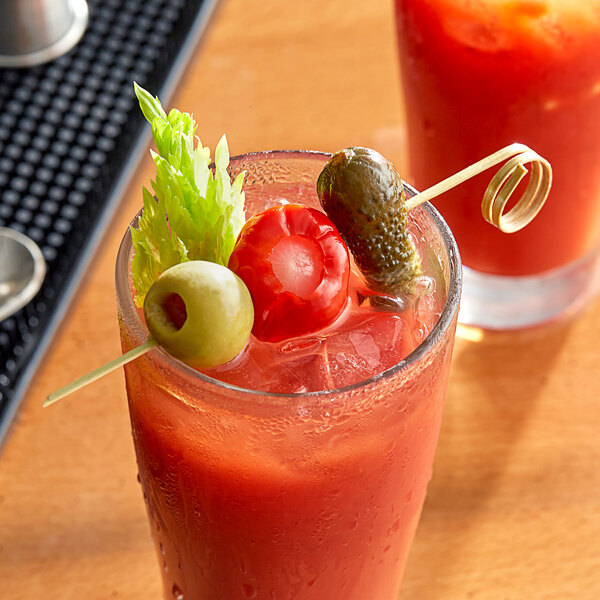 A Bamboo Loop Food Pick in a Bloody Mary with a pickle and cucumber garnish.