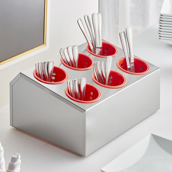 Stainless steel flatware in a red Choice flatware organizer.