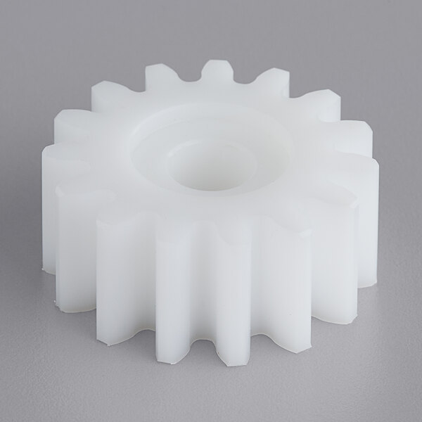 A white plastic gear with a hole for Estella dough sheeters.