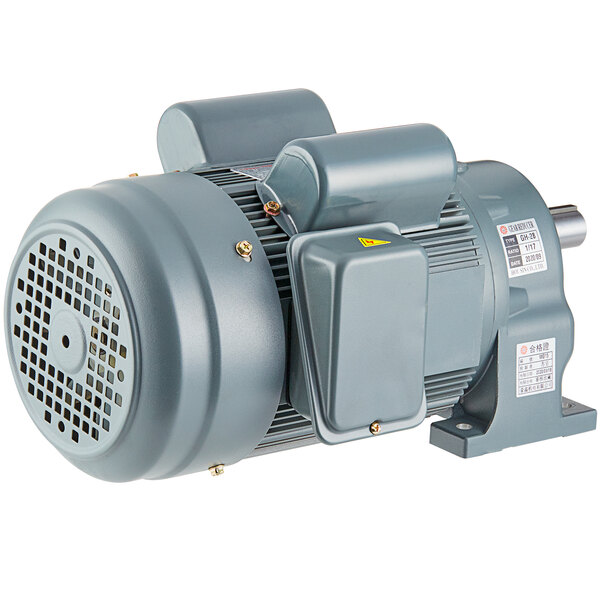 A close-up of a grey electric motor with a round cover.