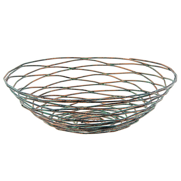 A Front of the House Patina hand-painted fused iron round basket with orange and green wire lines.