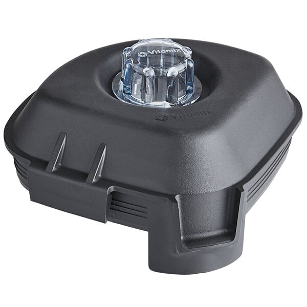 A black plastic container with a clear plastic lid with a black plug.