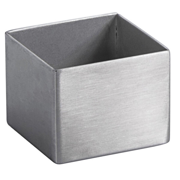 A silver metal square ramekin with a hole in the bottom.
