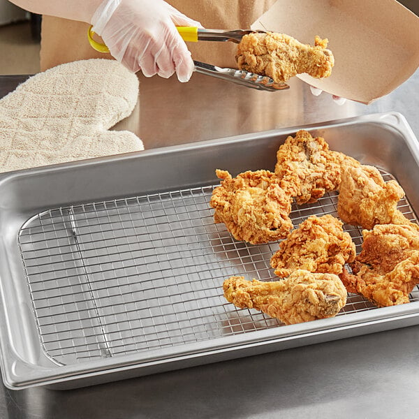 Fried chicken on a Vigor stainless steel wire rack.