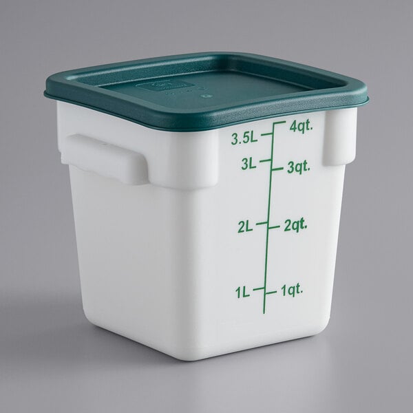 A white Choice square food storage container with a green lid.
