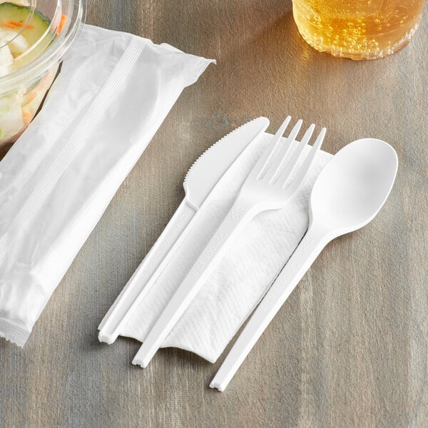 EcoChoice Wrapped Heavy Weight Compostable 6 1/2" White CPLA Knife, Fork, Spoon, and Napkin - 250/Case