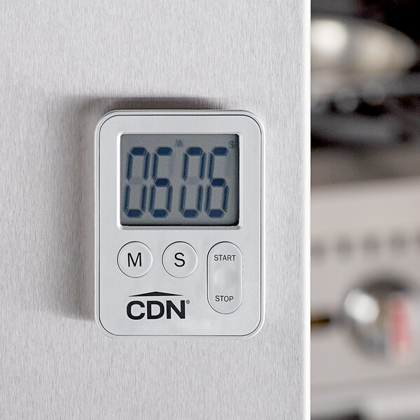 A silver CDN digital kitchen timer on a white surface.