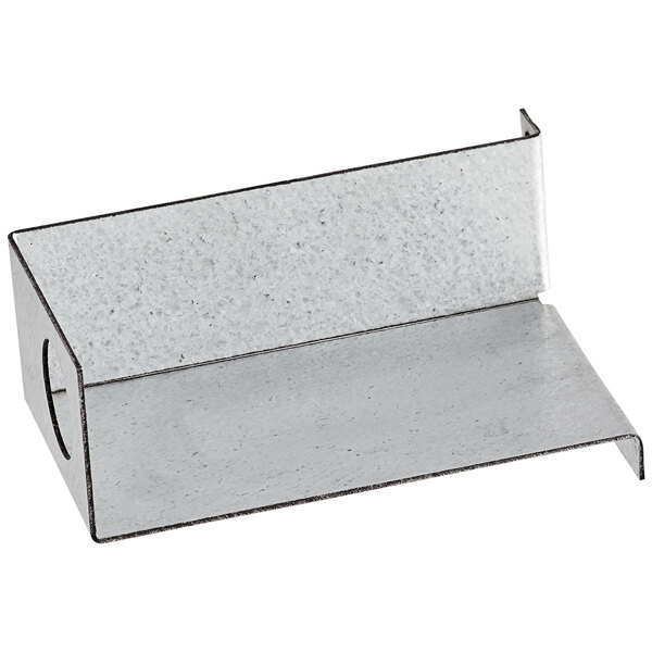 A rectangular metal box with a hole in a metal shelf.