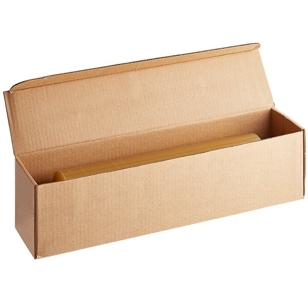 A brown cardboard box with a roll of Western Plastics perforated shrink wrap inside.