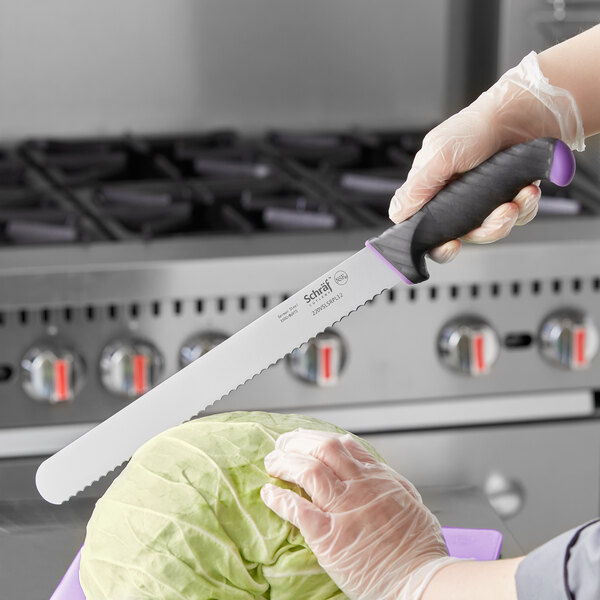A person using a Schraf serrated slicing knife to cut cabbage.