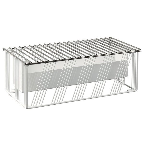 A white metal chafer alternative with metal rods and a grid on top.