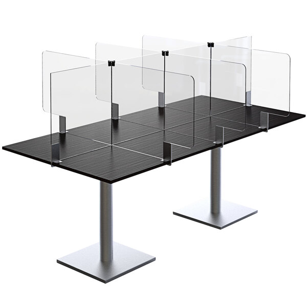 A table with clear screens on a table.