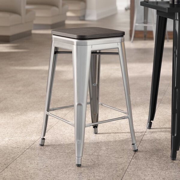 Lancaster Table & Seating Alloy Series Clear Coat Indoor Backless Counter Height Stool with Black Wood Seat