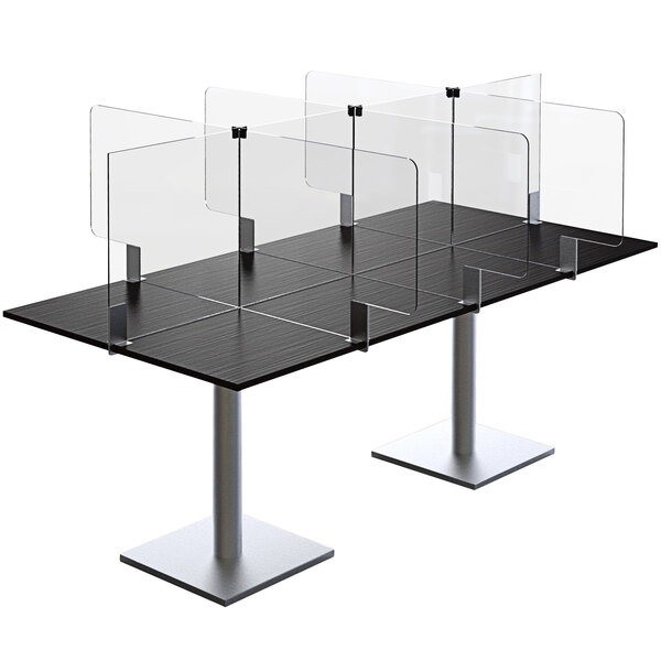 A black table with clear acrylic screens on top.