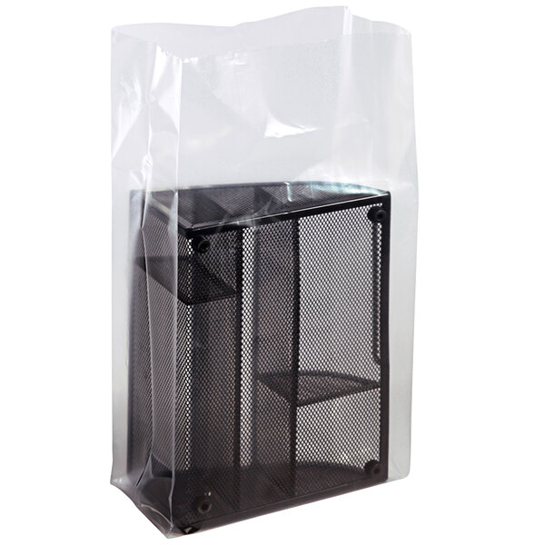 A clear plastic bag with a black mesh object inside.