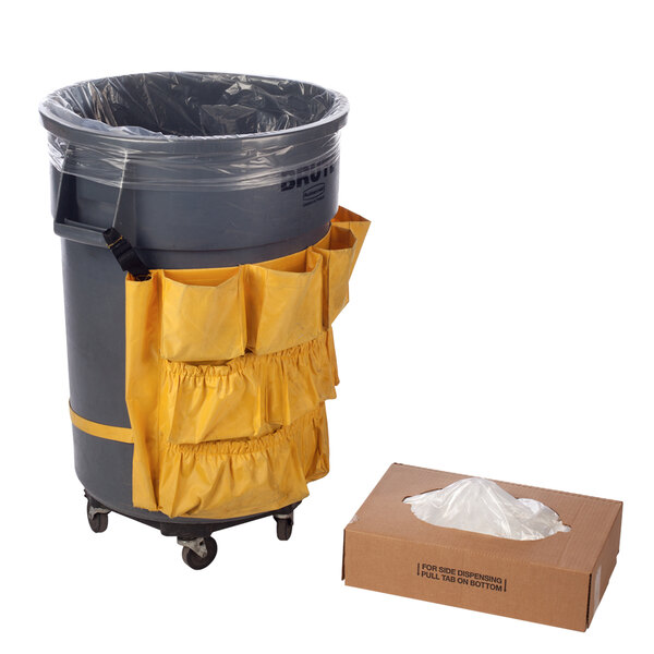 A grey trash can with a box of Lavex clear polyethylene furniture covers over it.