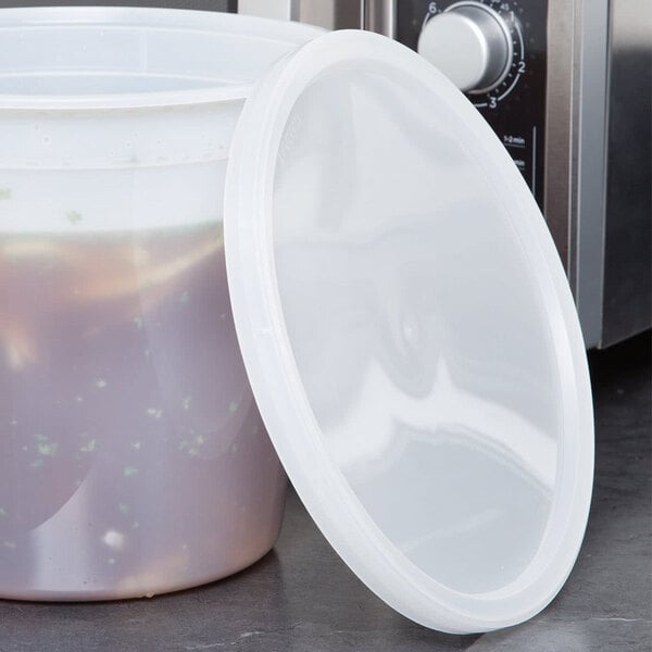 A 8 1/4" translucent plastic lid on a microwavable round deli container.