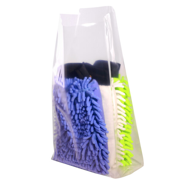 A clear plastic bag with a group of colorful microfiber cloths and sponges.