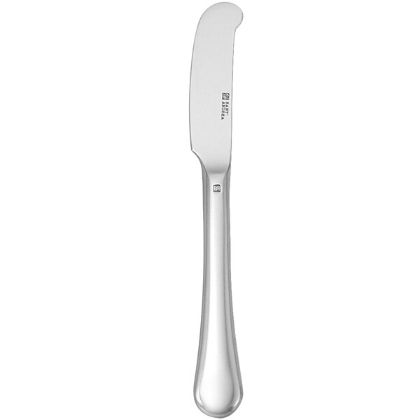 A Sant'Andrea Puccini silver butter knife with a white handle.