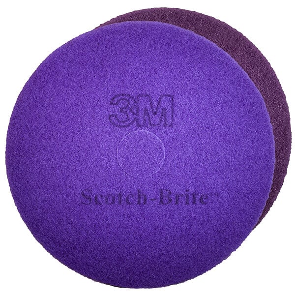 A Square Scrub 3M Scotch-Brite purple diamond round floor pad.