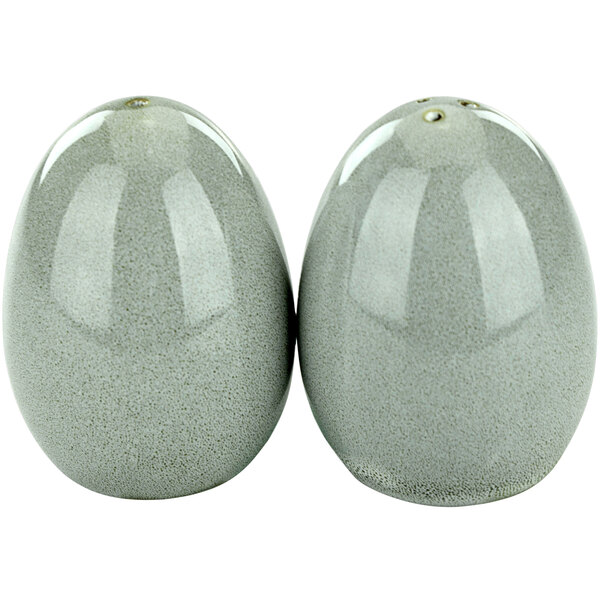 Two grey egg-shaped International Tableware Luna salt and pepper shakers.