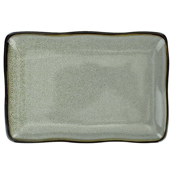 A white rectangular porcelain platter with black edges.
