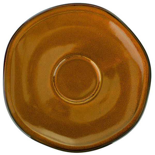 A brown terracotta porcelain saucer with a brown circle in the middle.