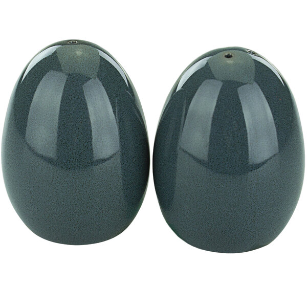 A pair of midnight blue egg-shaped salt and pepper shakers.