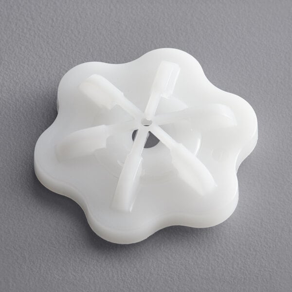 The white plastic Bunn 7 hole sprayhead with fan blades shaped like a flower.