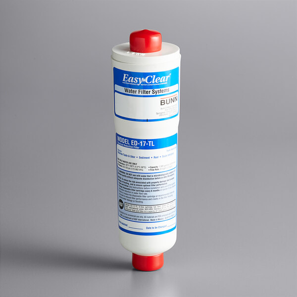 A close-up of a white Bunn water filter cartridge with a red cap.