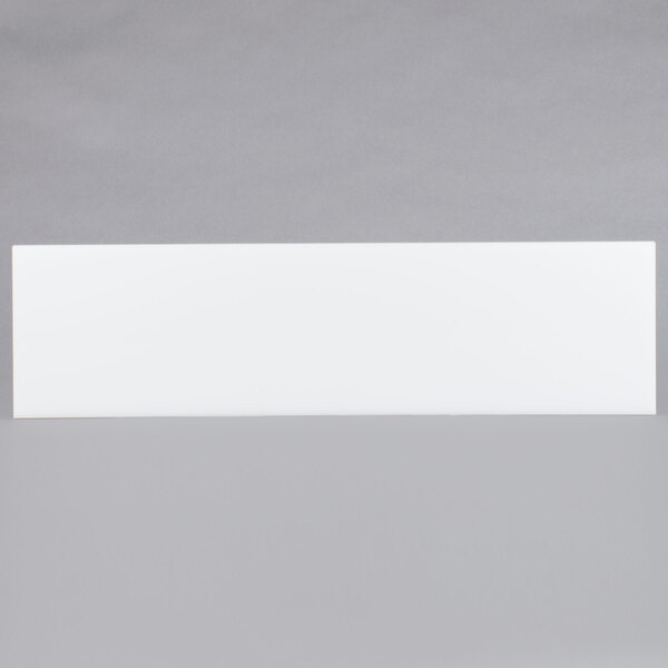 A white rectangular object with a black border.