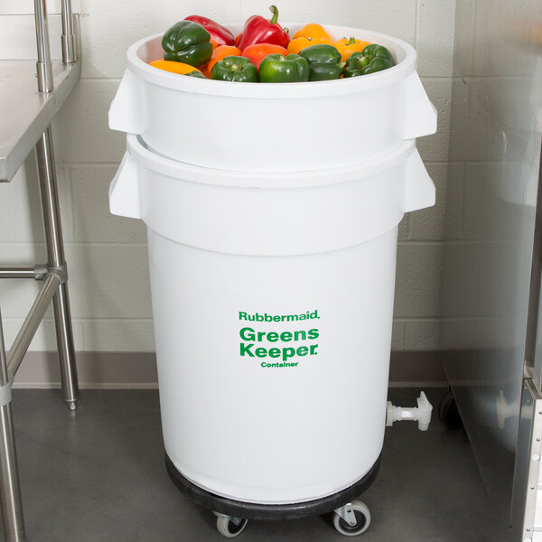 A white Rubbermaid container with a lid and green text filled with vegetables.