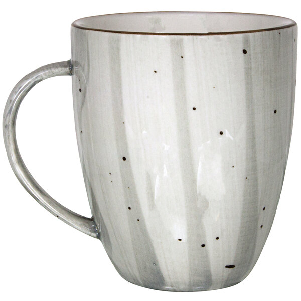 A white porcelain cup with a speckled stone design.