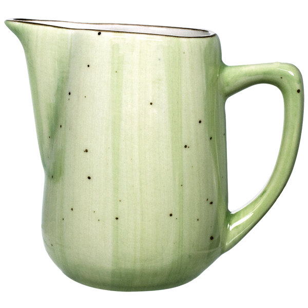 An International Tableware lime green porcelain creamer with speckled dots.