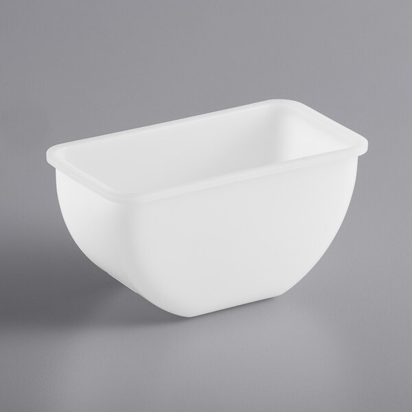 A white plastic bowl on a gray surface.