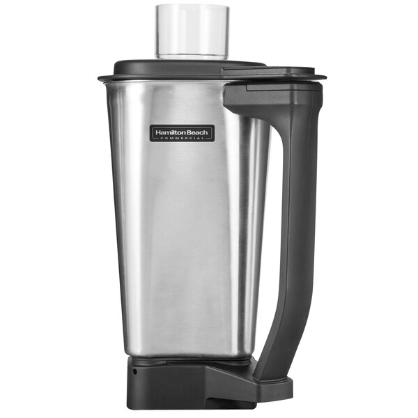 A Hamilton Beach stainless steel blender jar with blade and lid.