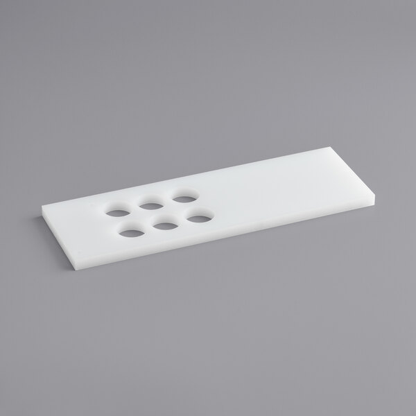 A white rectangular plastic tray with holes.