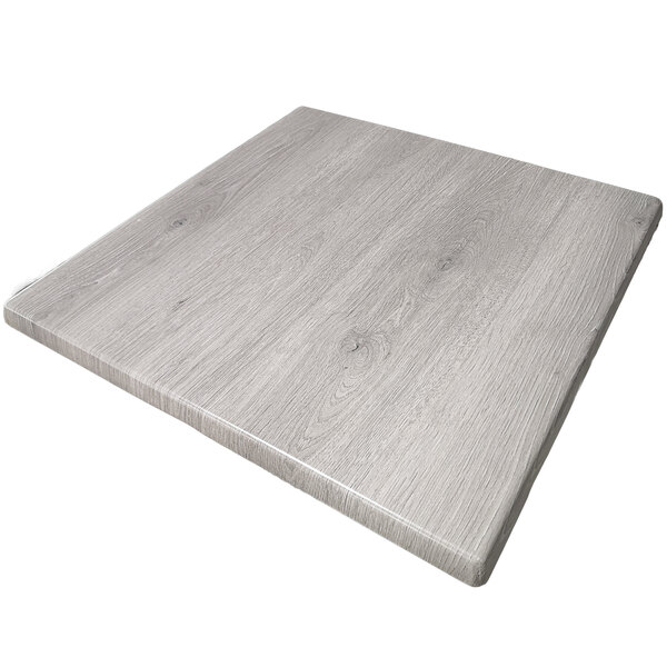 An American Tables & Seating square wood table top with a gray finish.
