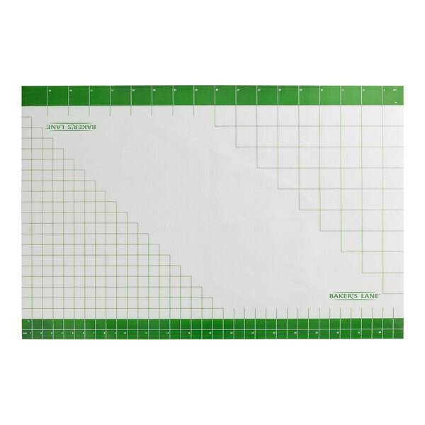 A large rectangular silicone mat with a green grid pattern and measurement markings along the edges.