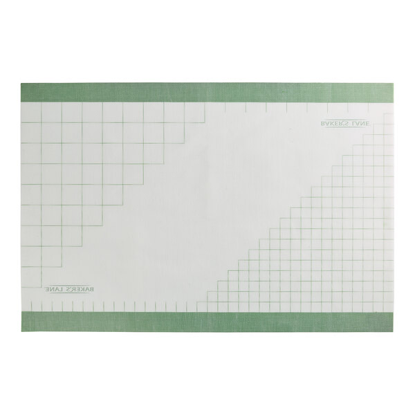 A rectangular silicone work mat with a green border and a grid pattern printed on the surface.