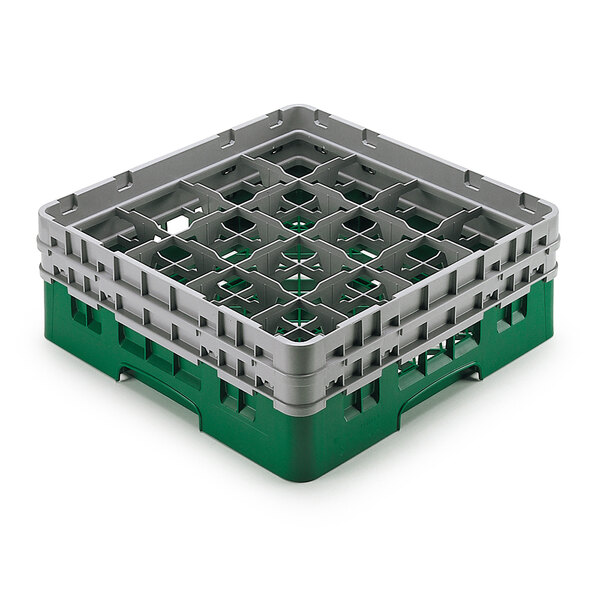 A green and grey plastic Cambro glass rack with extenders.