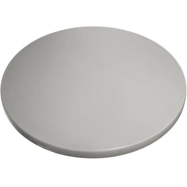 A white circular American Tables & Seating Isotop table top.