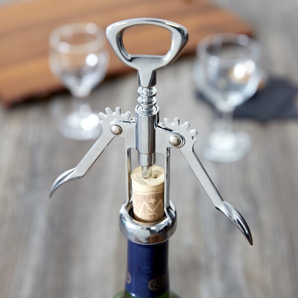 A Choice wing corkscrew with a cork in it.