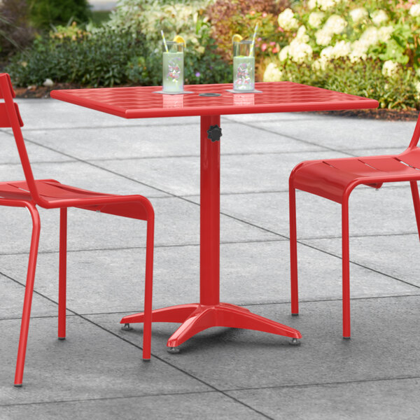 Lancaster Table & Seating 24" x 32" Red Powder-Coated Aluminum Dining Height Outdoor Table with Umbrella Hole